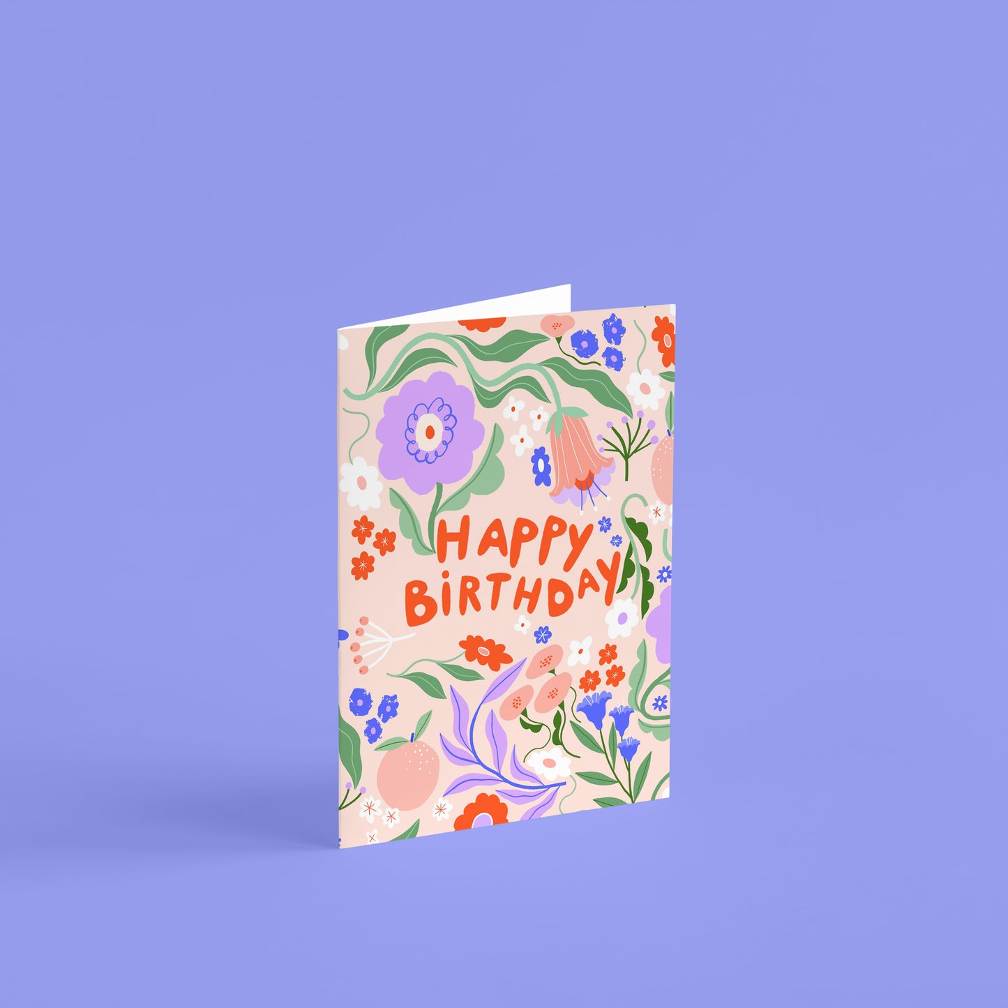 cute floral happy birthday card, with pink background, lilac peach and green flowers and leaves with red writing. 