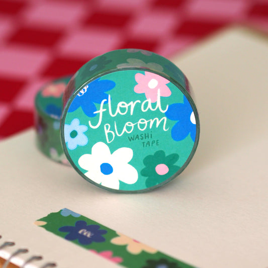 green floral washi tape with pink white and blue flowers and a green background