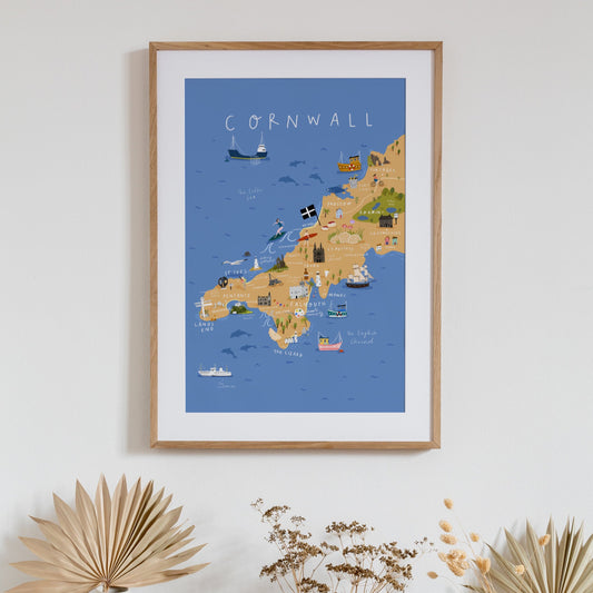 illustrated map of Cornwall, with all major landmarks and labels of places, written at the top is 'Cornwall' in white. The background is blue for the sea with boats, surfers and seagulls.