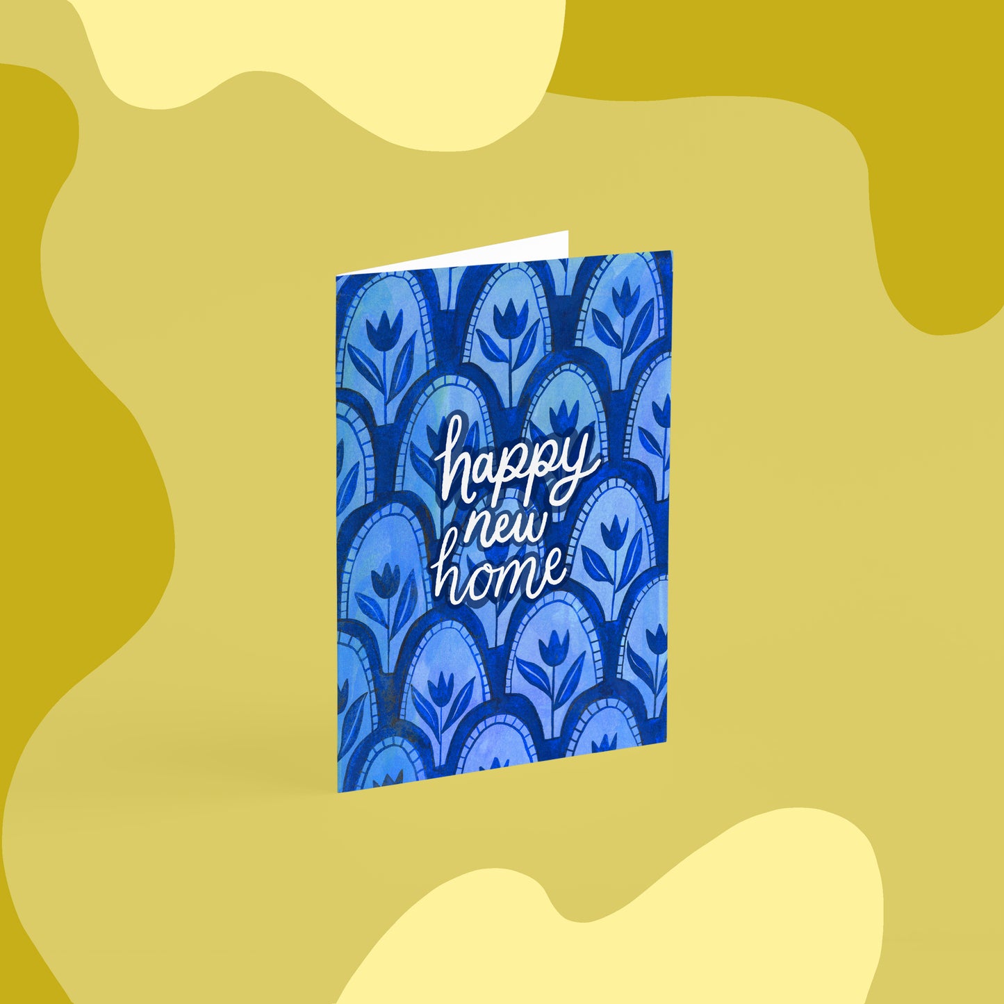 Blue tile patterned new home card that reads 'happy new home' in the centre in white.